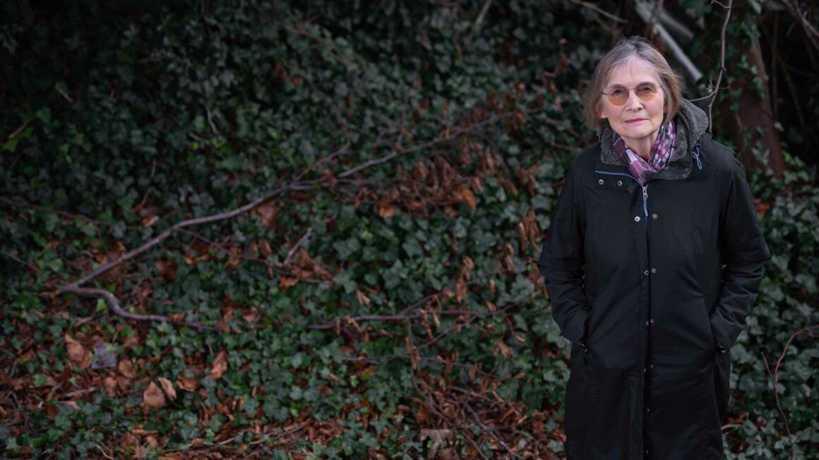 Author Danuta Reah standing among undergrowth